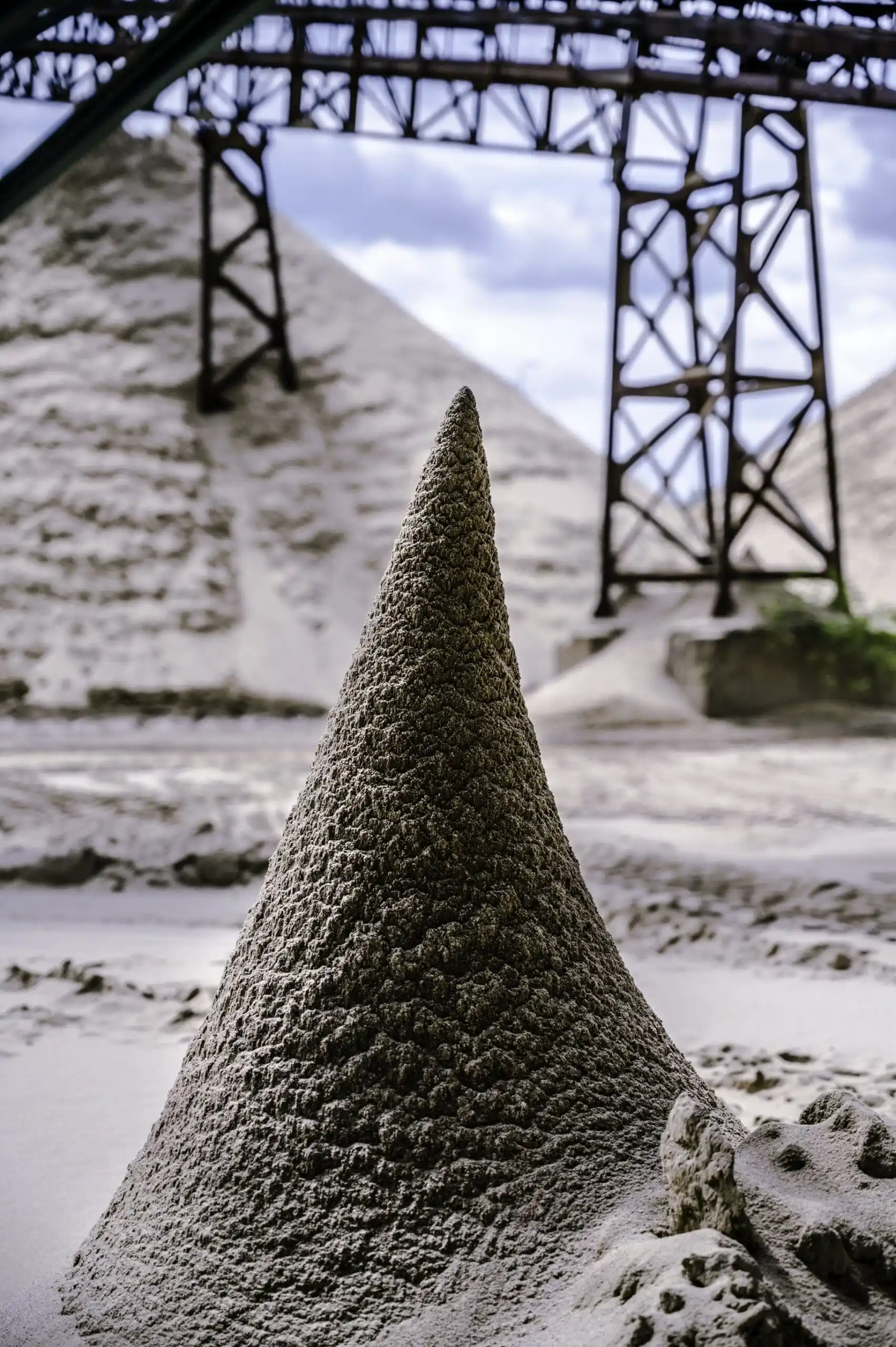 vertical-shot-of-a-cone-like-sand-pile-2025-02-02-20-22-00-utc-min-scaled